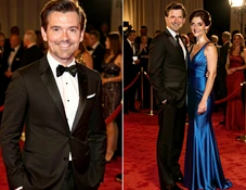 Two people's faces swapped onto a famous celebrity couple's bodies in a formal portrait, both faces blending naturally with the original hairstyles and outfits, the overall image resembling a real celebrity couple photo from a magazine spread.
